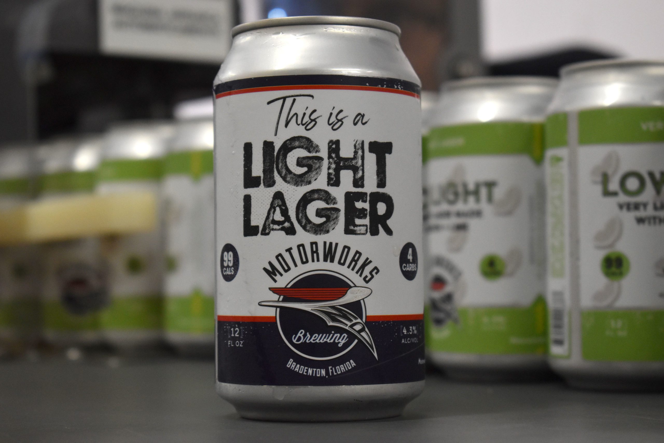 This is a Light Lager can on canning line in front of Low Light Lager cans